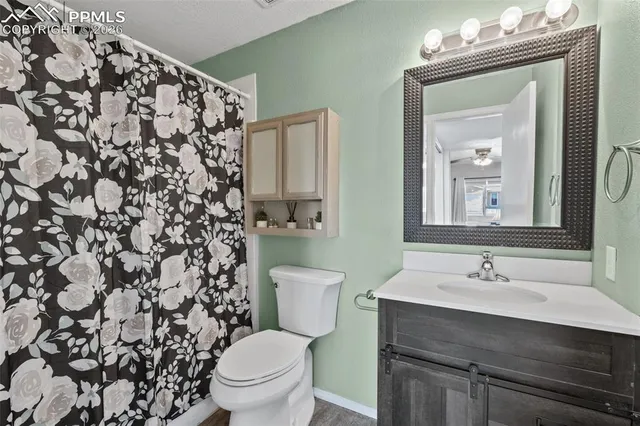 a kitchen with stainless steel appliances granite countertop a stove and a refrigerator