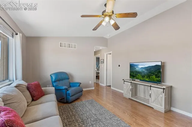 a living room with furniture or couch and a flat screen tv