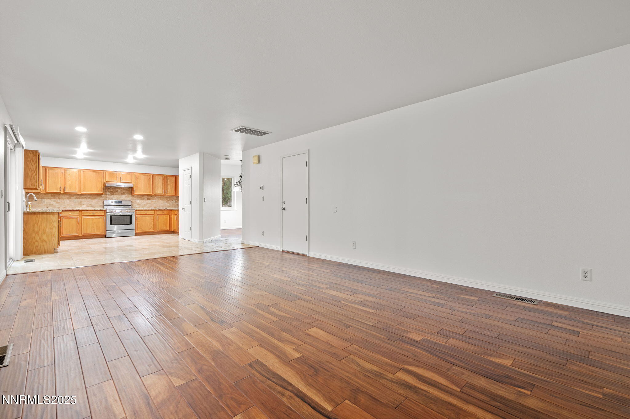 5455 Montego Court Reno, NV 89523 - Photo 11 of 36 a view of a room with wooden floor and a kitchen