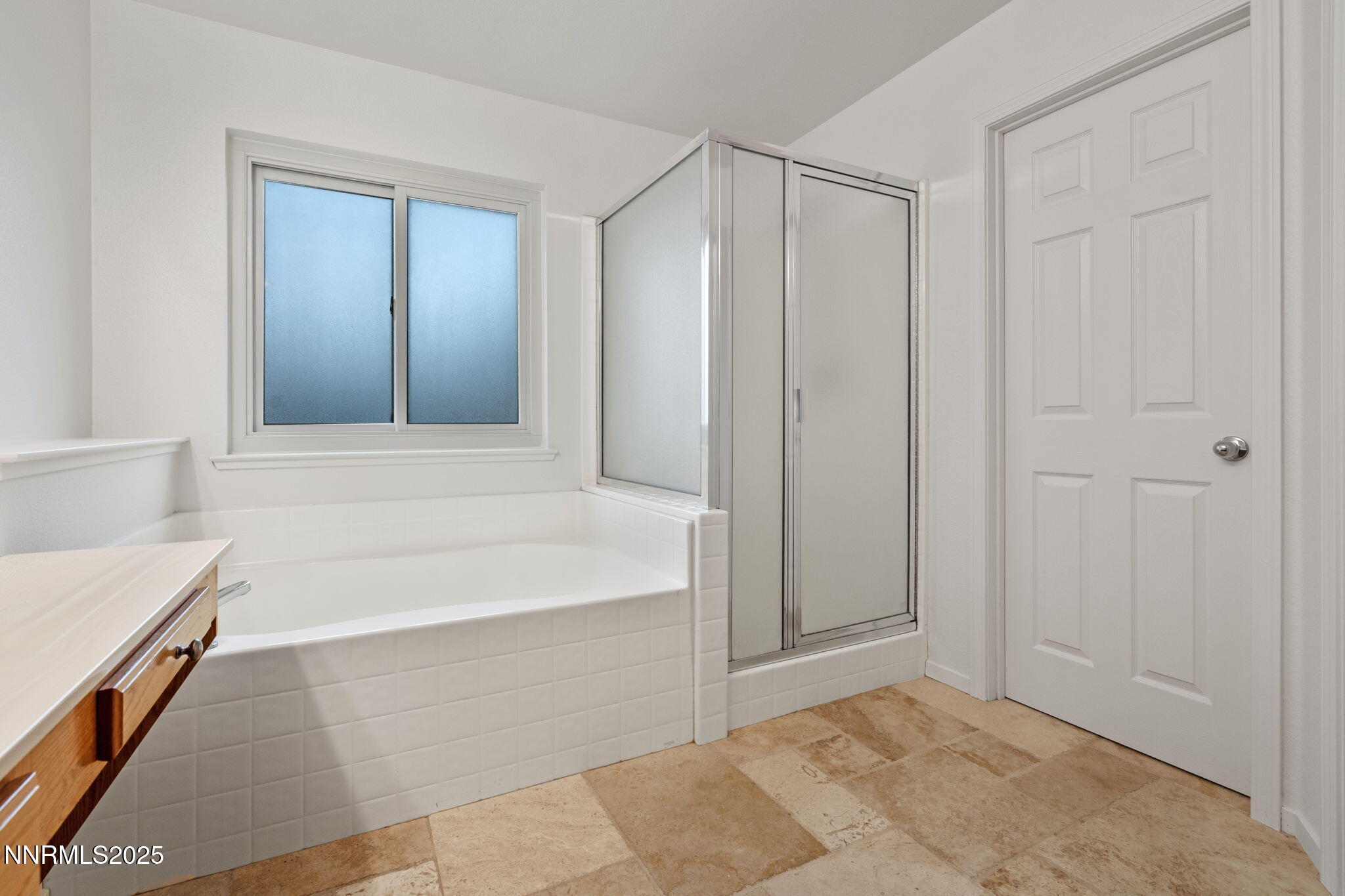5455 Montego Court Reno, NV 89523 - Photo 24 of 36 a bathroom with a bathtub and a shower