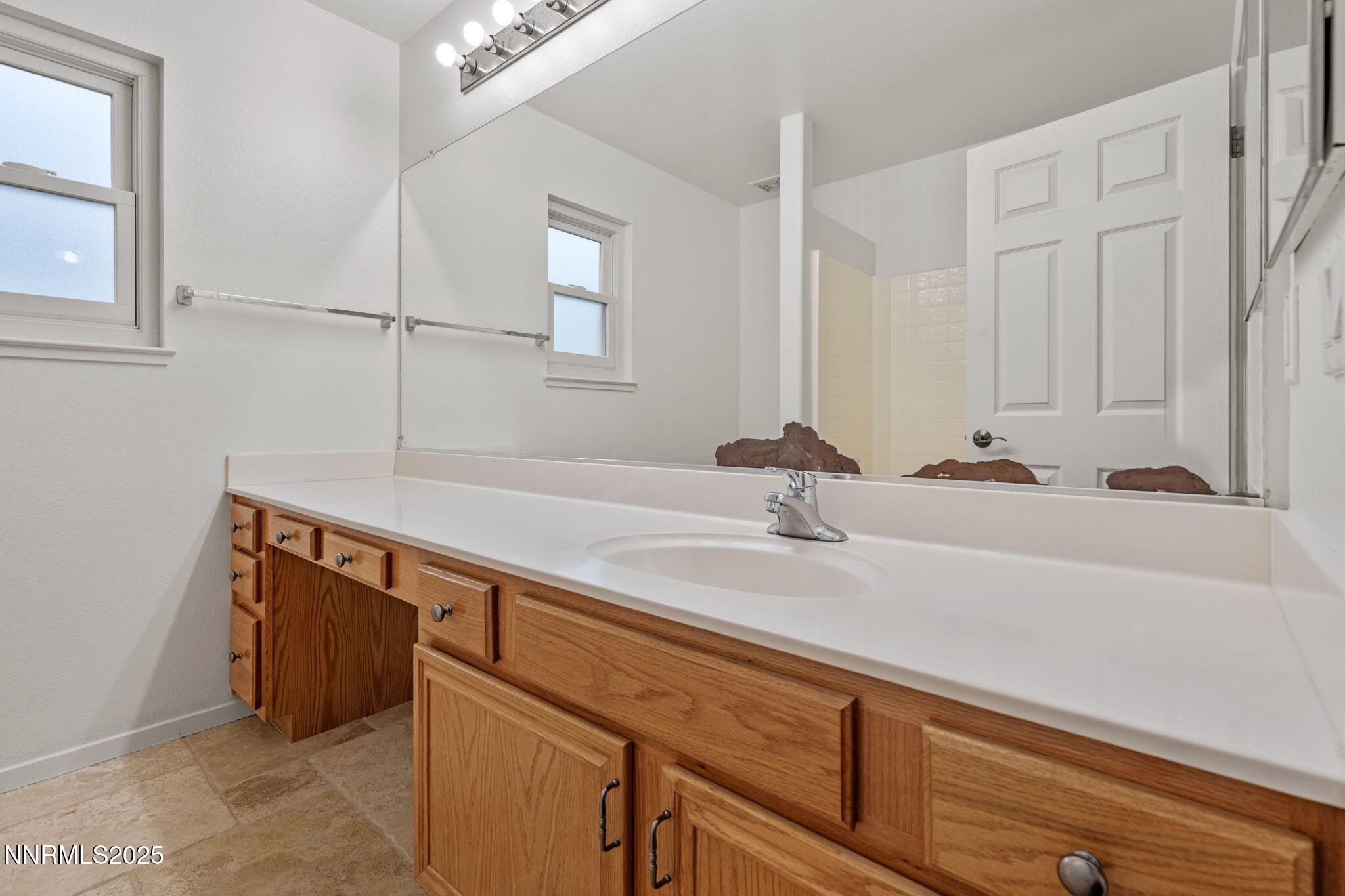 5455 Montego Court Reno, NV 89523 - Photo 25 of 36 a bathroom with a sink and a mirror