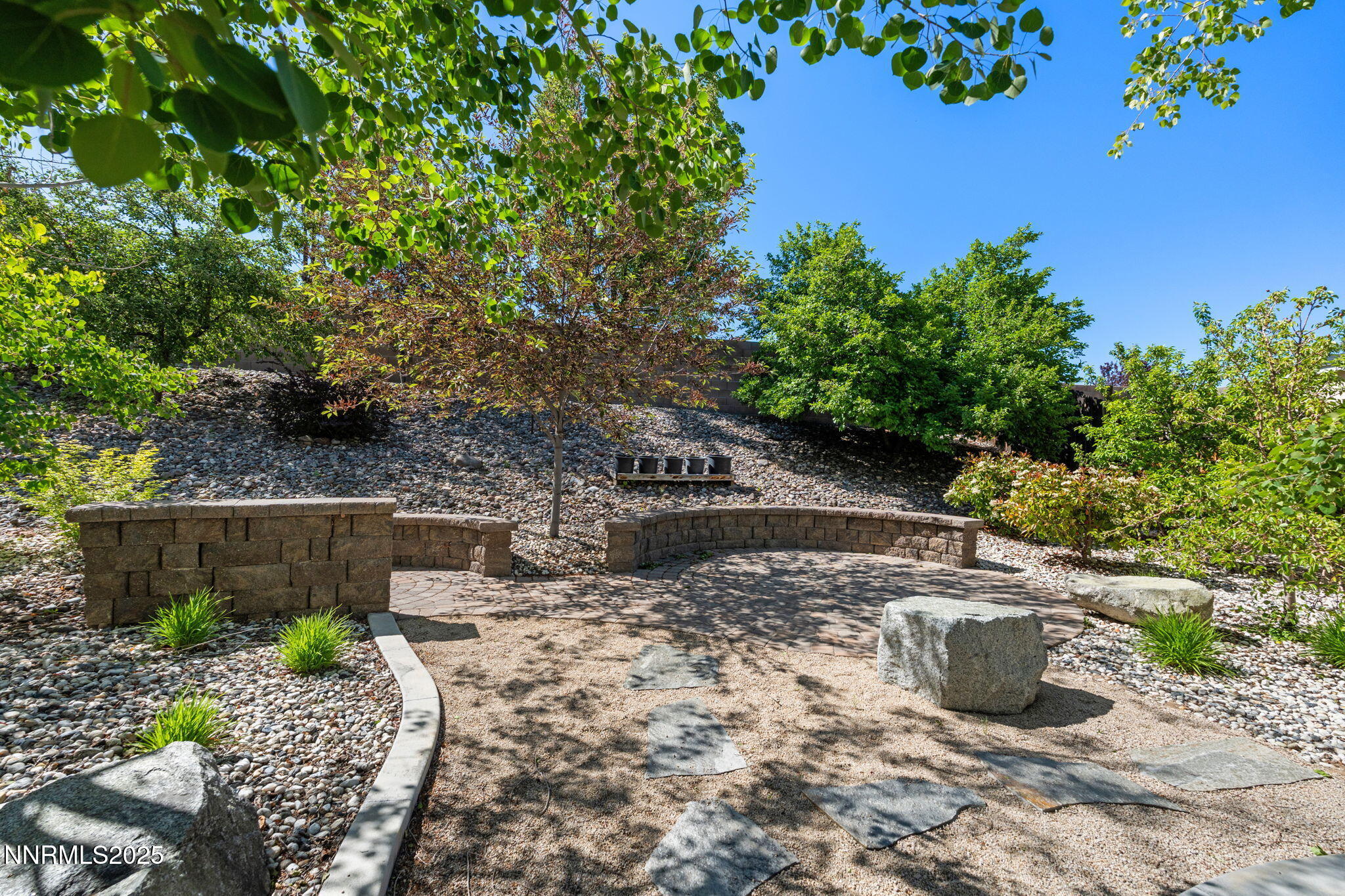 5455 Montego Court Reno, NV 89523 - Photo 35 of 36 a view of a backyard with plants and a patio