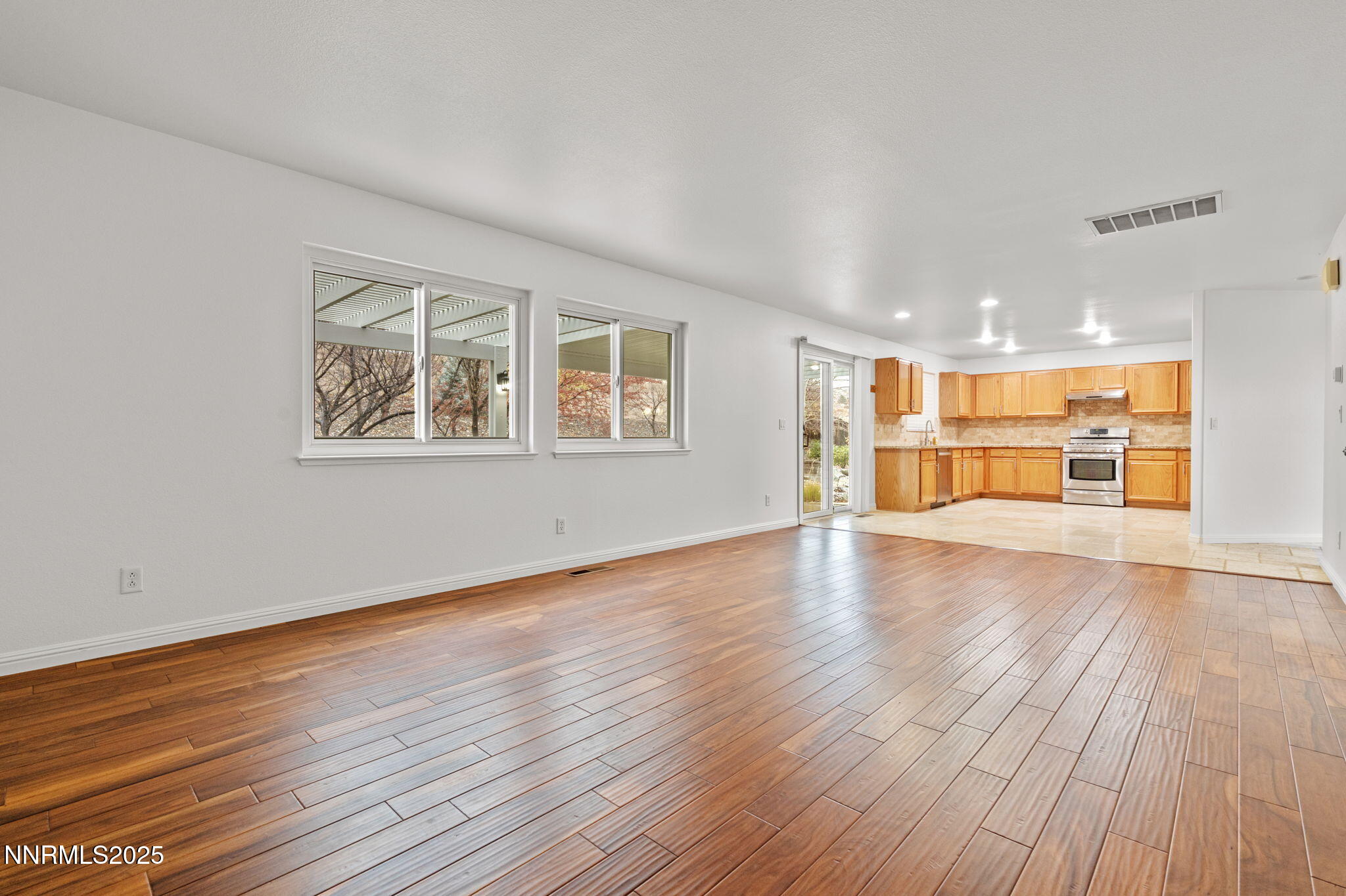 5455 Montego Court Reno, NV 89523 - Photo 9 of 36 a view of an empty room with wooden floor and a window