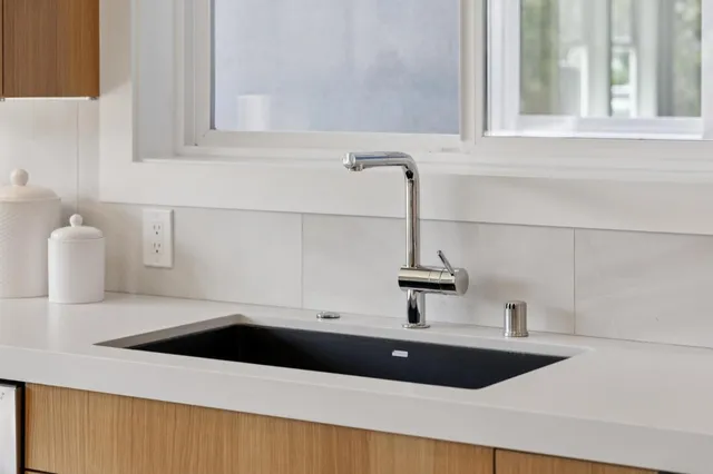 a kitchen with a sink and a window