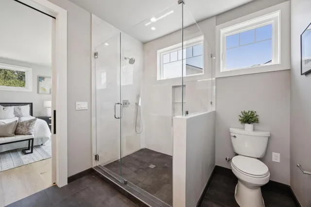 a bathroom with a toilet sink and shower