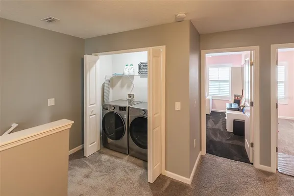 a view of a storage & utility room with washer and dryer