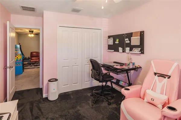 a view of a workspace with furniture