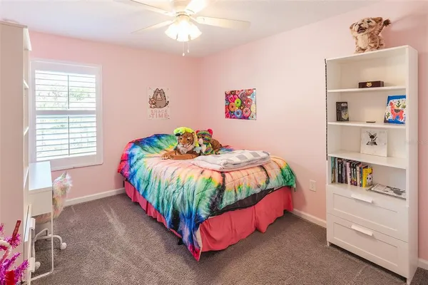 a bed room with a bed and a window