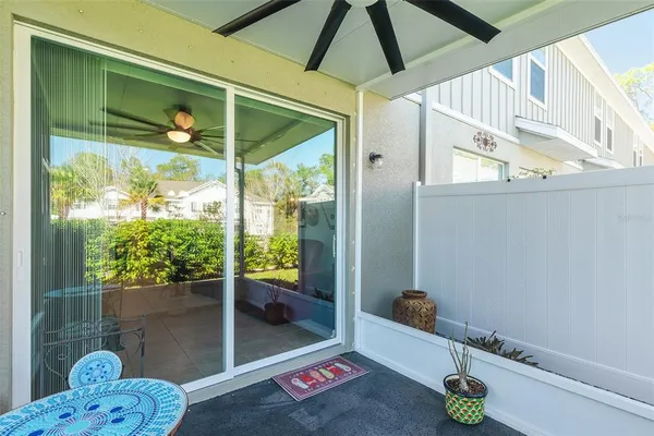 a view of a house with a yard and sitting area