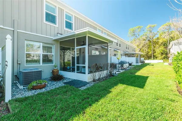 a room with furniture and a potted plant