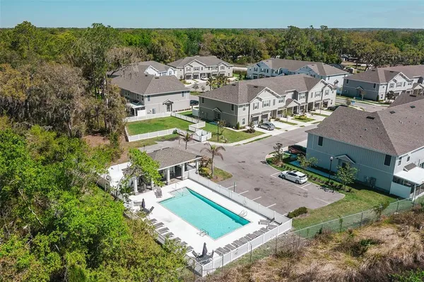 a view of a swimming pool with chairs