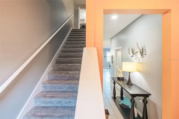 a view of entryway and hall with wooden floor