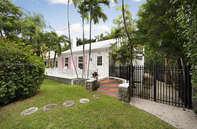 a view of a chairs and table in backyard