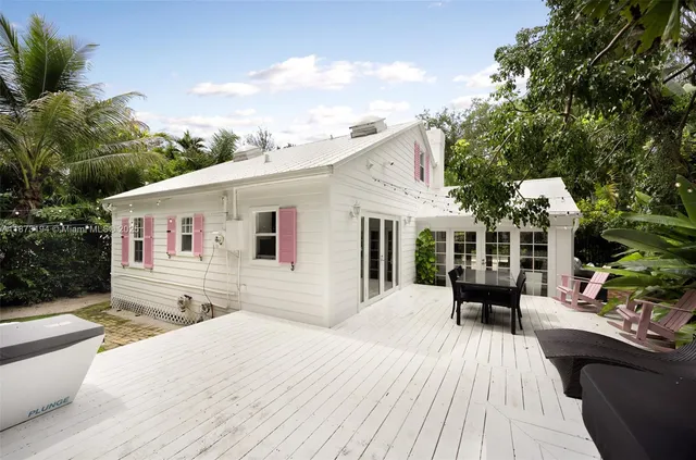 a front view of house with yard outdoor seating and barbeque oven