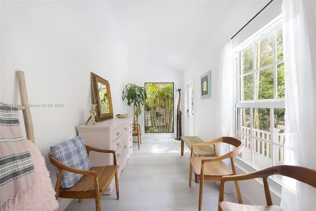 a dining room with furniture and windows
