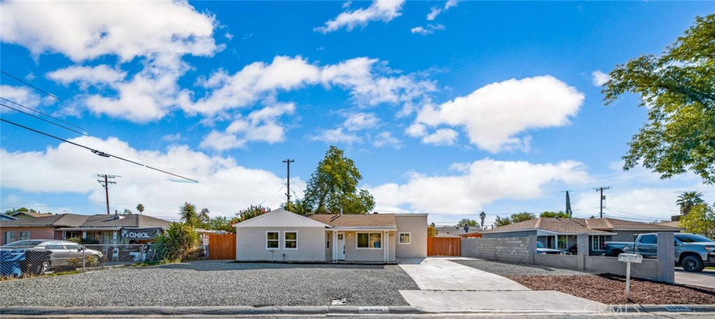 6540 Lake Street Riverside, CA 92503 - Photo 1 of 1 a front view of a house with garden
