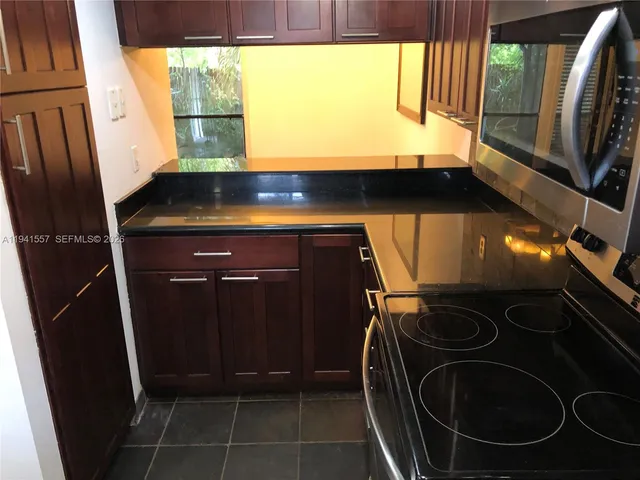 a bathroom with a sink a toilet and a shower