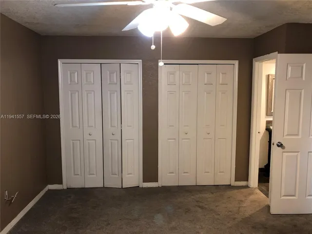 an empty room with closet area