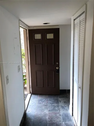 a view of entryway with wooden floor