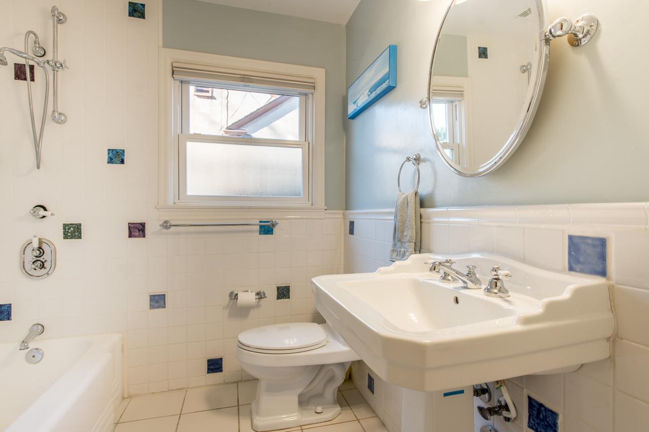 308 Princeton Road Menlo Park, CA 94025 - Photo 15 of 22 a bathroom with a sink a toilet and a mirror
