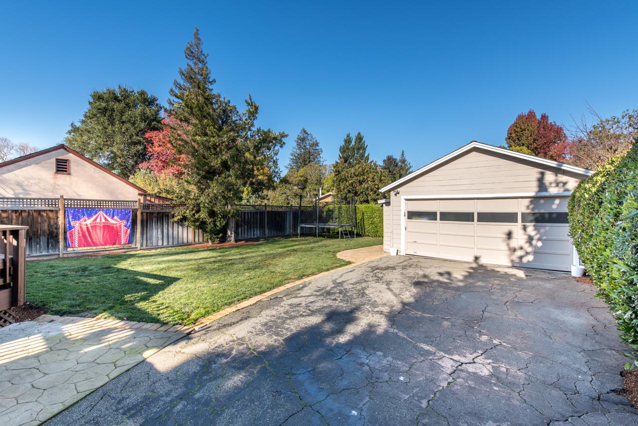 308 Princeton Road Menlo Park, CA 94025 - Photo 18 of 22 a front view of a house with a yard and garage