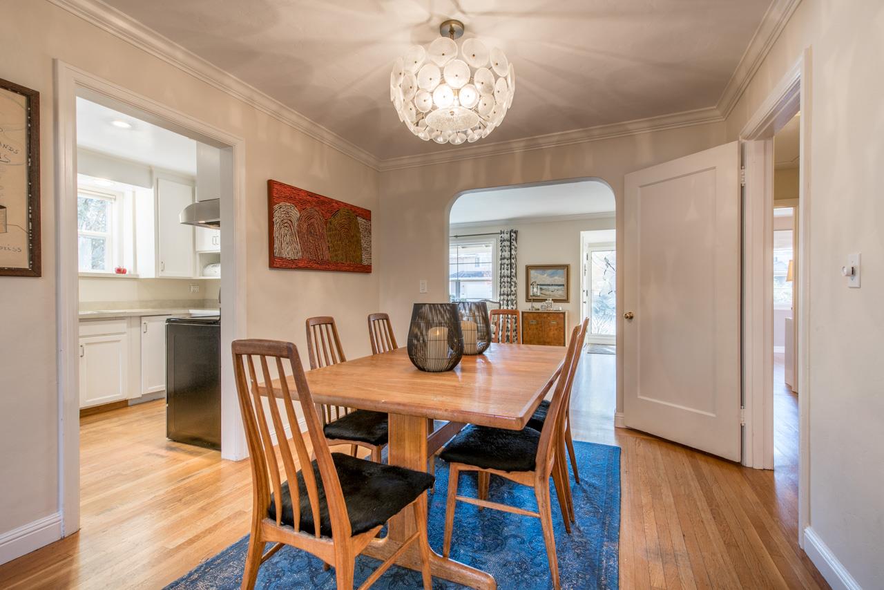 308 Princeton Road Menlo Park, CA 94025 - Photo 6 of 22 a view of a dining room with furniture wooden floor and a chandelier
