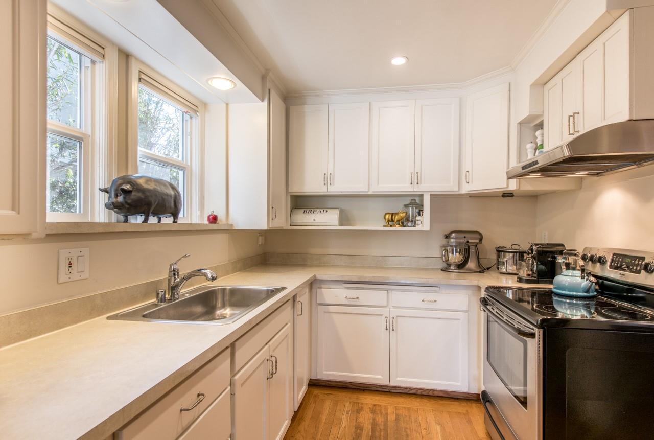 308 Princeton Road Menlo Park, CA 94025 - Photo 9 of 22 a kitchen with a sink stove and cabinets