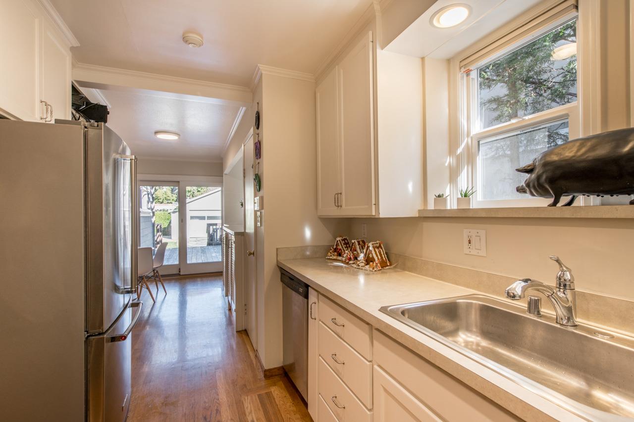308 Princeton Road Menlo Park, CA 94025 - Photo 10 of 22 a kitchen with a sink a refrigerator and cabinets