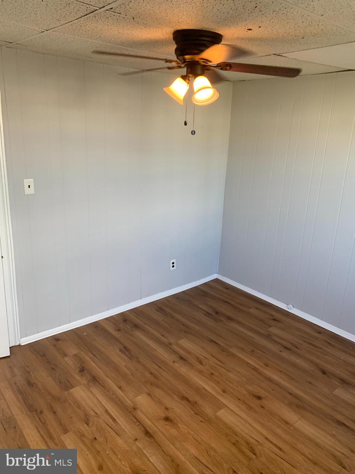 4135 Gilham Street Philadelphia, PA 19135 - Photo 12 of 12 a view of an empty room with wooden floor