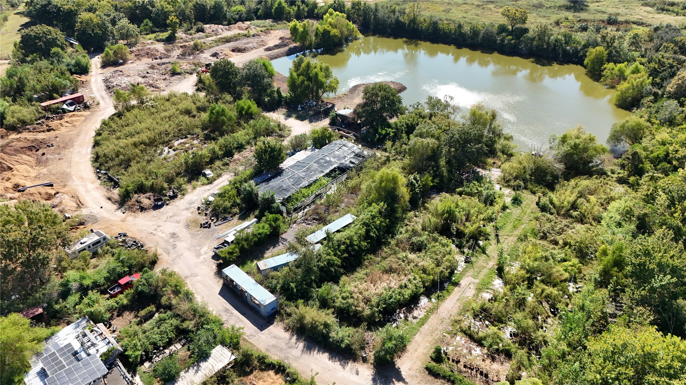 an aerial view of a houses with a lake view
