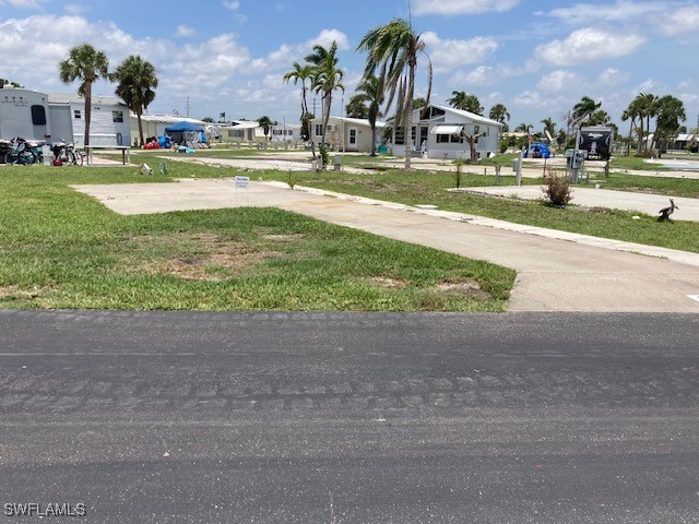 19681 Summerlin Road Fort Myers, FL 33908 - Photo 2 of 7 a view of yard with swimming pool and green space