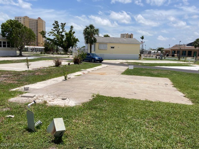 19681 Summerlin Road Fort Myers, FL 33908 - Photo 4 of 7 a backyard of a house with lots of green space and lake view in back