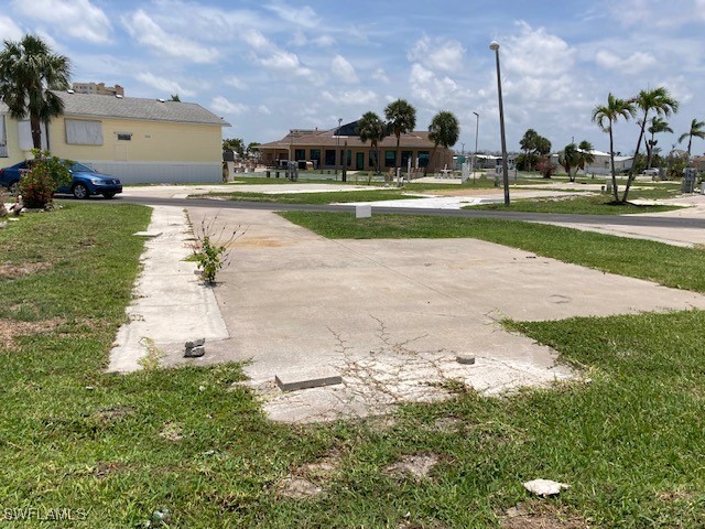 19681 Summerlin Road Fort Myers, FL 33908 - Photo 5 of 7 a view of a fountain in front of a house with a big yard