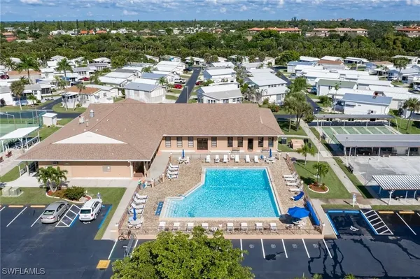 an aerial view of multiple houses with yard