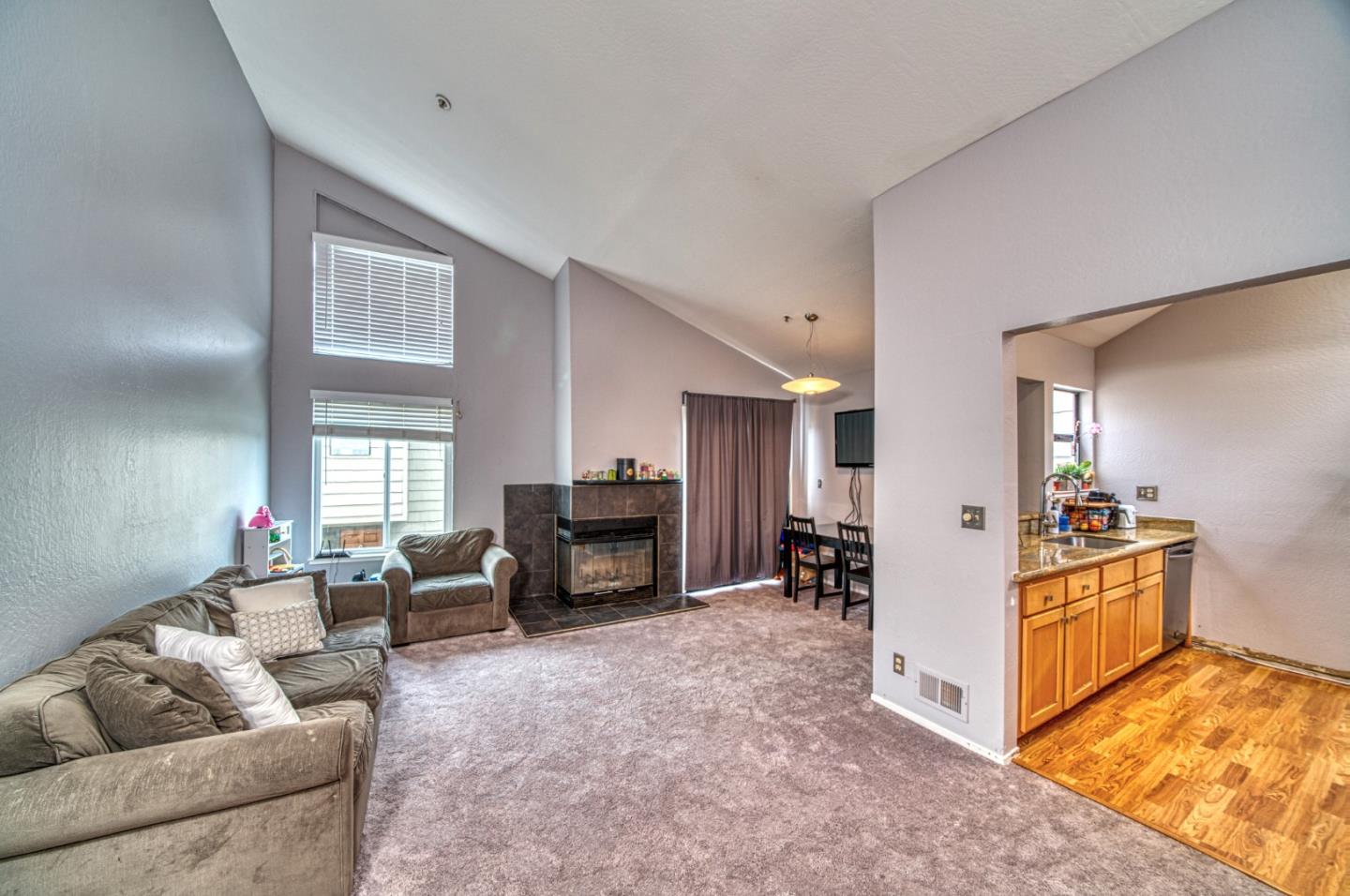 923 Linda Mar Boulevard Pacifica, CA 94044 - Photo 11 of 31 a living room with furniture and a fireplace