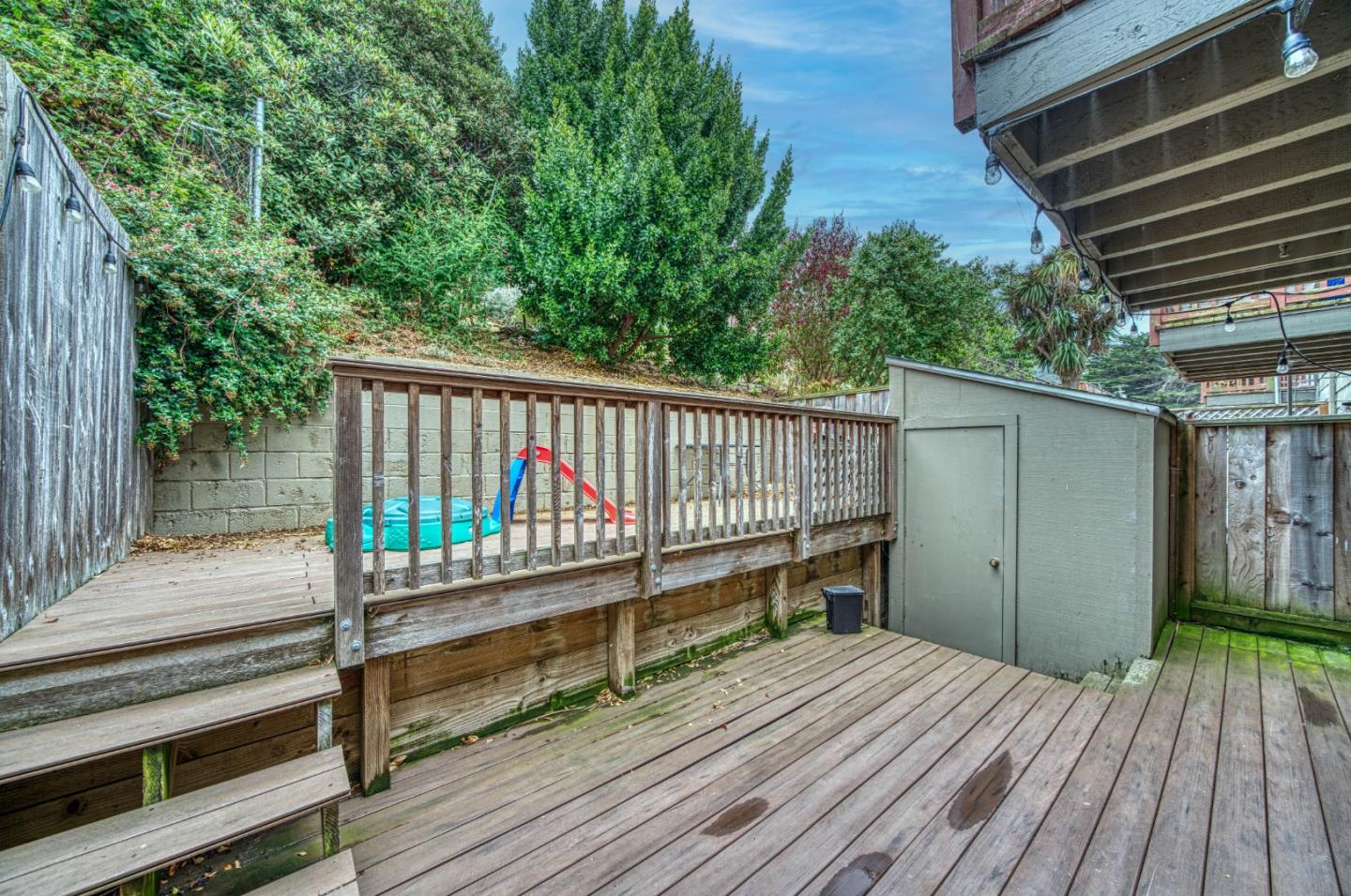 923 Linda Mar Boulevard Pacifica, CA 94044 - Photo 22 of 31 a view of a wooden deck and a backyard