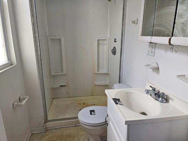 5421 West Main Street Monee, IL 60449 - Photo 13 of 13 a bathroom with a sink a toilet and shower