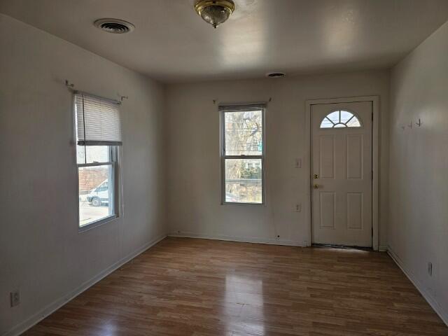 5421 West Main Street Monee, IL 60449 - Photo 2 of 13 a view of an empty room with wooden floor and a window