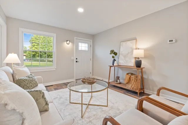 a living room with furniture and a window