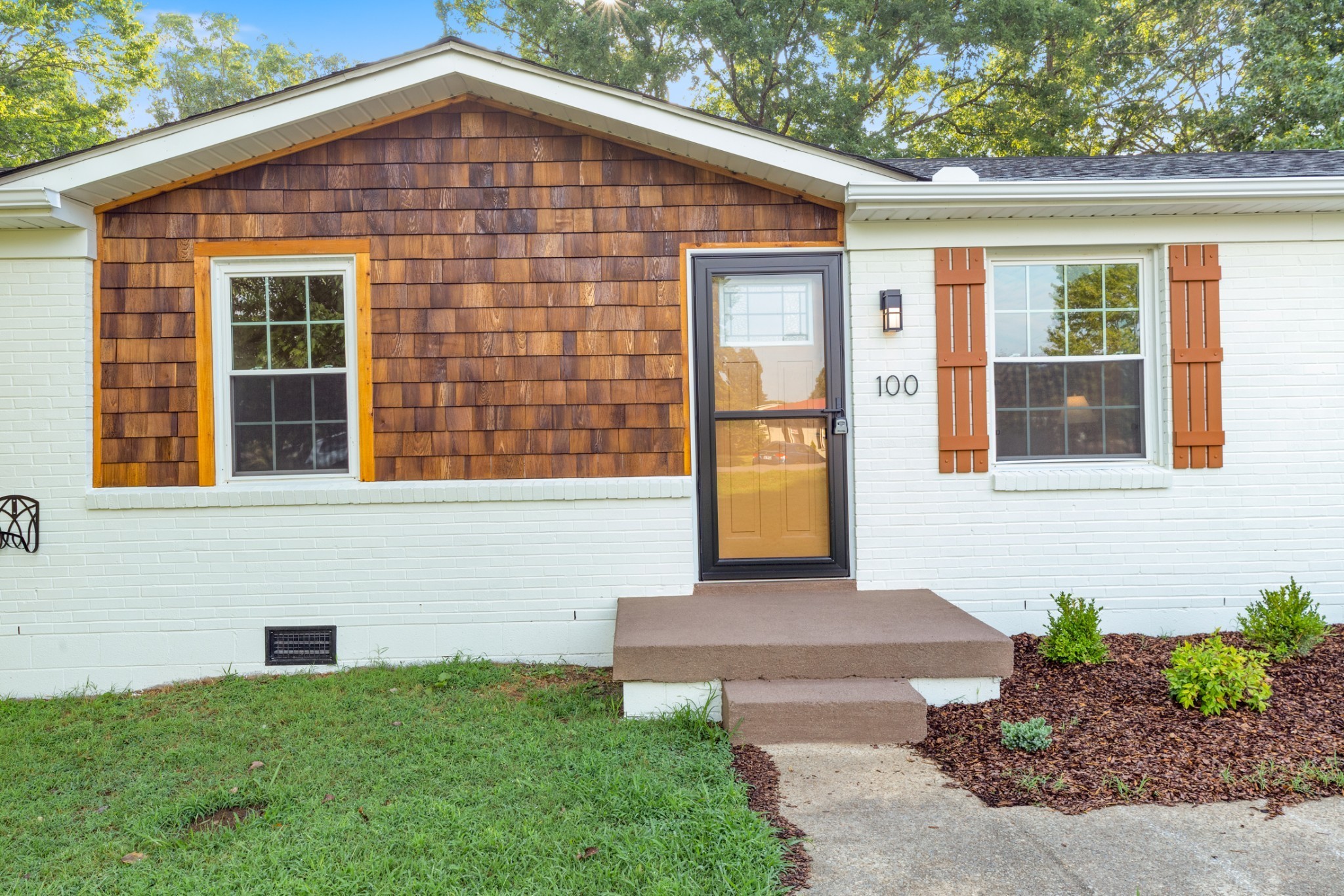 100 Short Street Dickson, TN 37055 - Photo 2 of 33 a front view of a house with garden