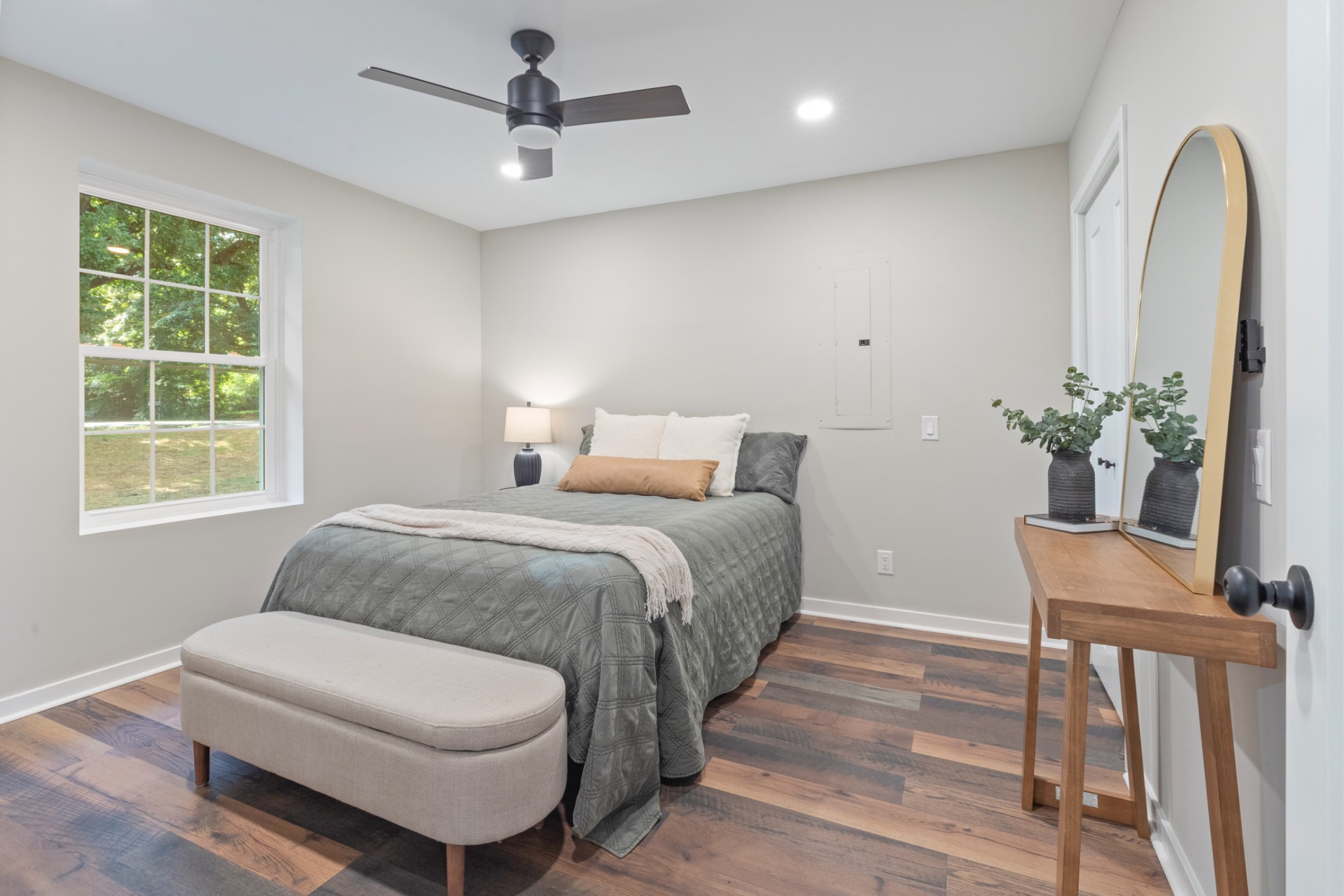 100 Short Street Dickson, TN 37055 - Photo 22 of 33 a bedroom with a large bed and a potted plant