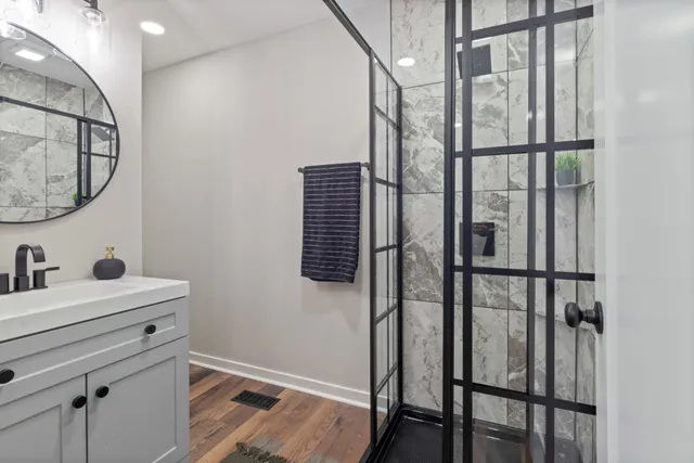a bathroom with a sink and a mirror