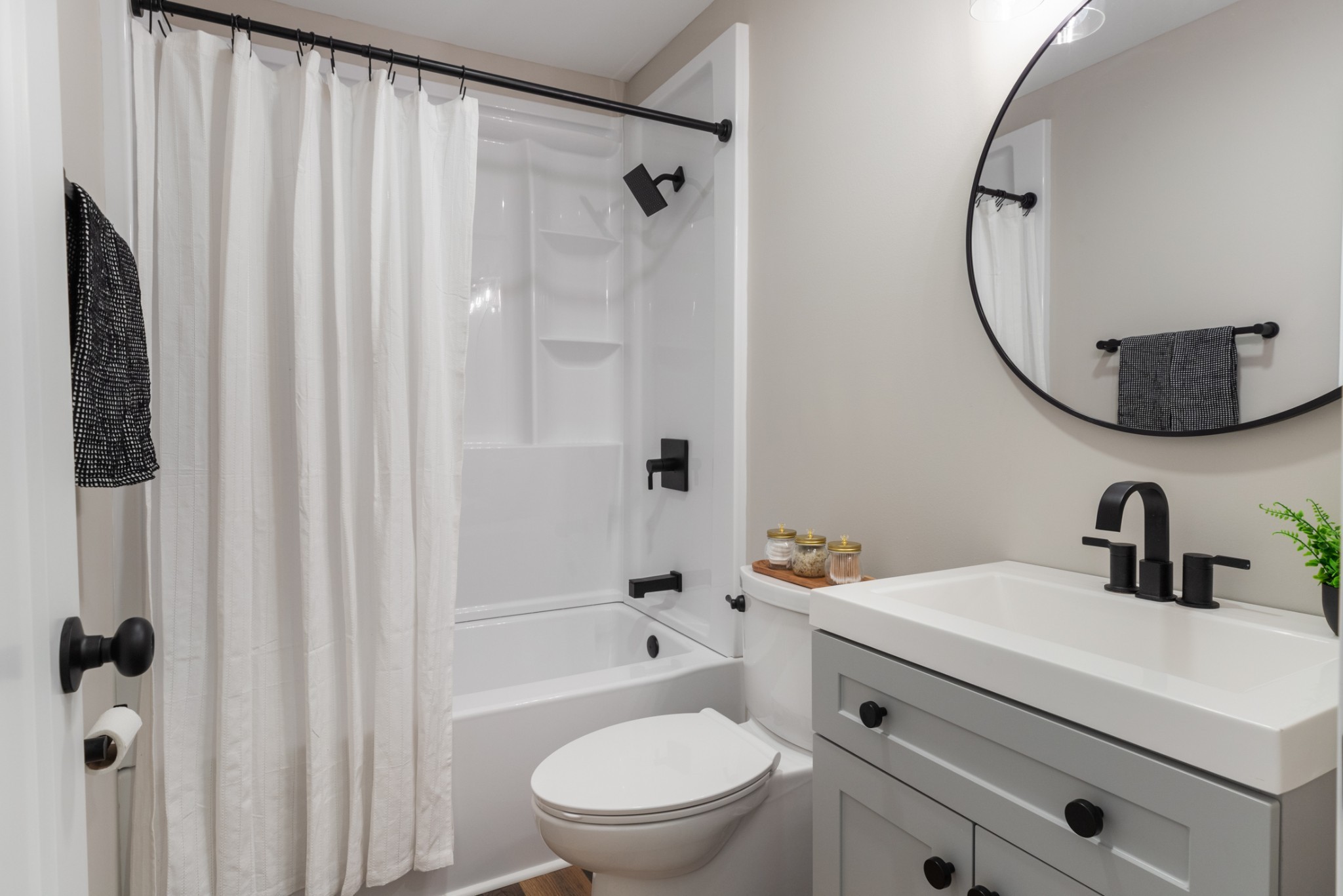 100 Short Street Dickson, TN 37055 - Photo 32 of 33 a bathroom with a sink a toilet and a mirror