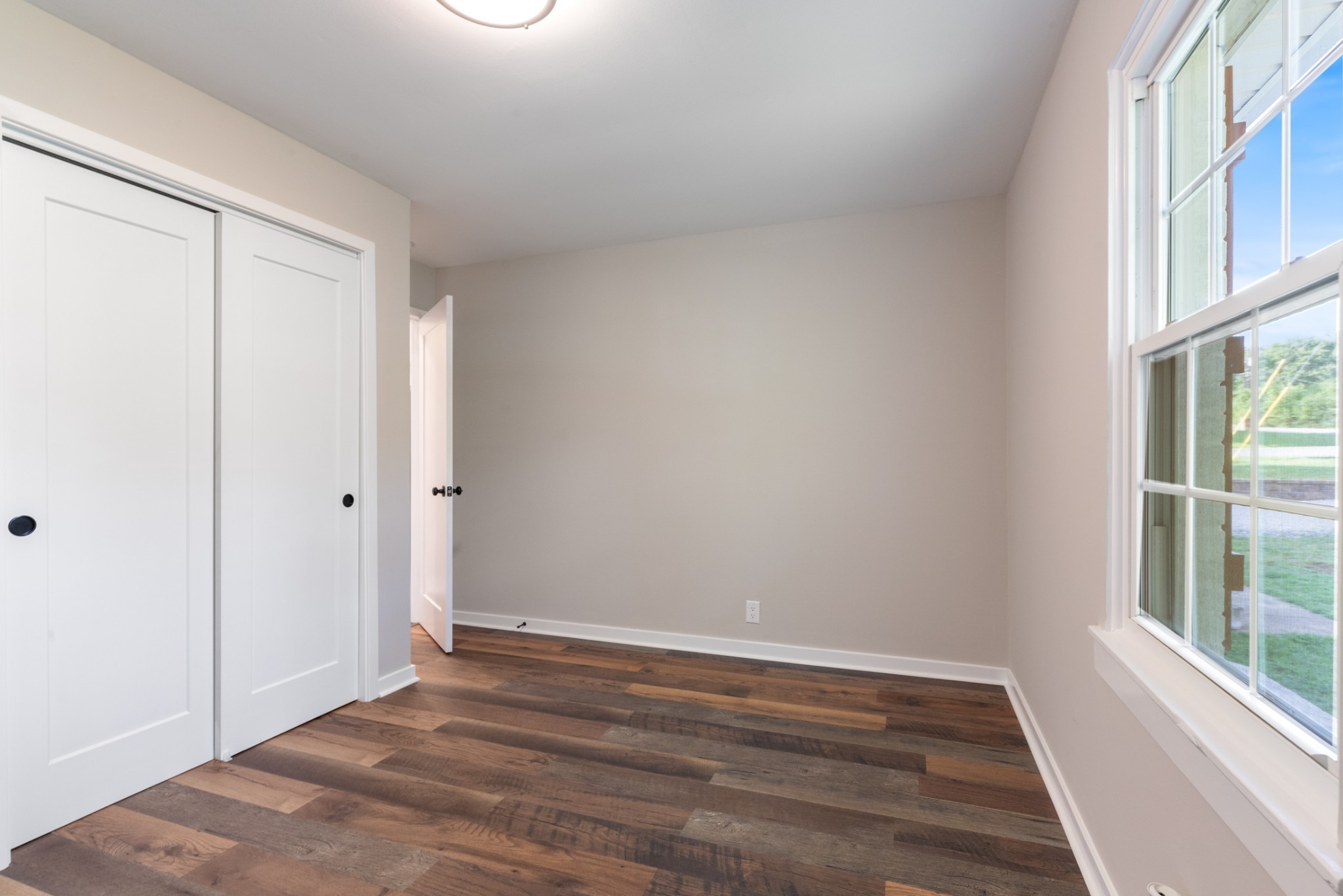 100 Short Street Dickson, TN 37055 - Photo 33 of 33 a view of an empty room with wooden floor and a window