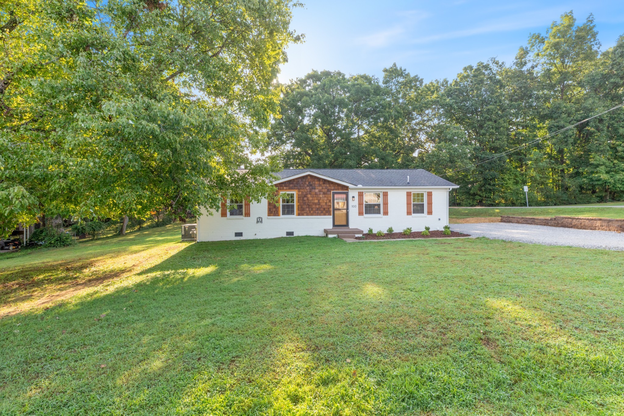 100 Short Street Dickson, TN 37055 - Photo 7 of 33 a front view of a house with garden