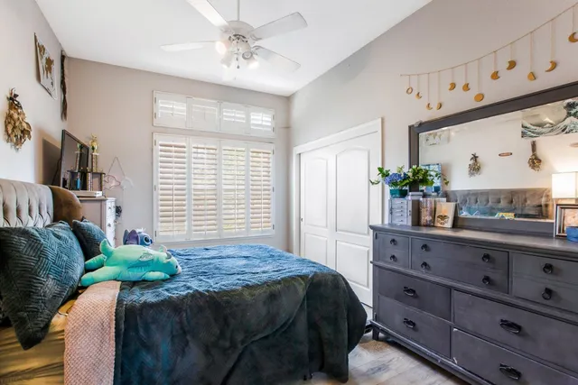 a bedroom with a bed and a dresser