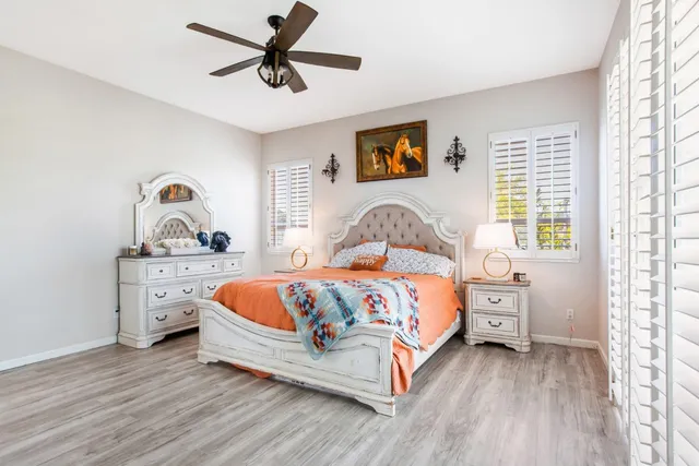 a view of a house with backyard porch and sitting area