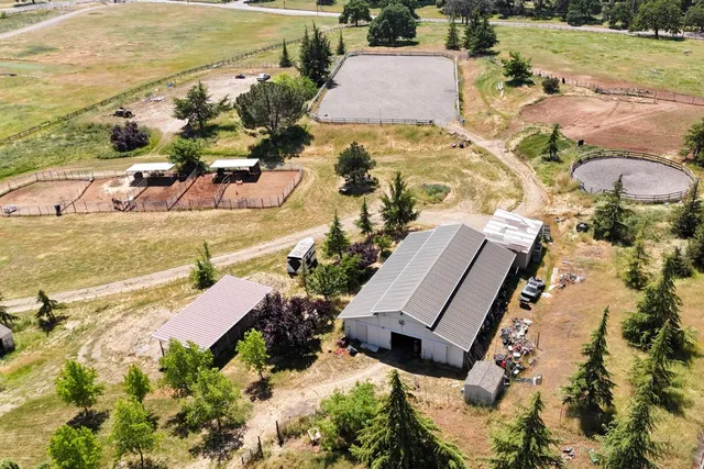an aerial view of a house with a ocean view