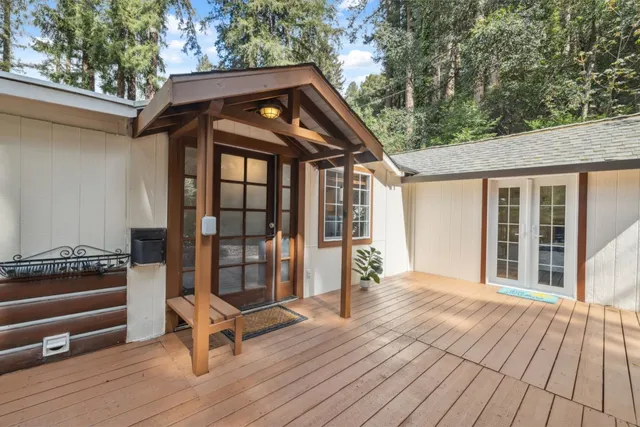 a view of a chairs and table in the balcony