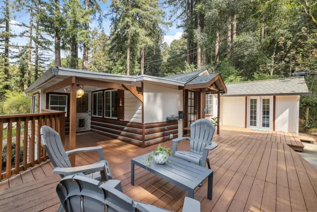 a view of a chair and table on the deck